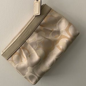 Multicolored cream tone Coach wristlet